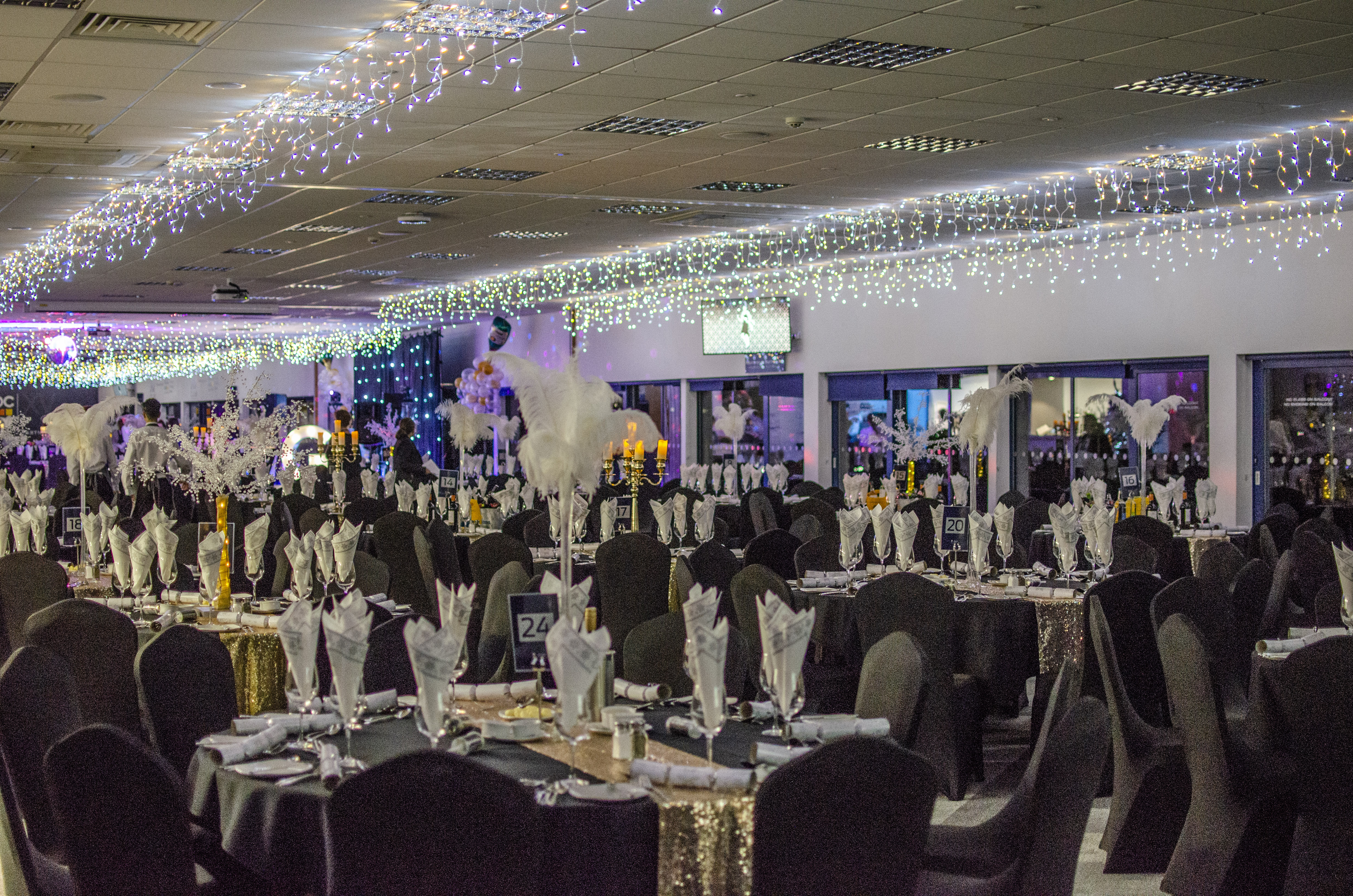 Elegant Pitchview Suite at Sixways Stadium, perfect for gala events with black and gold decor.