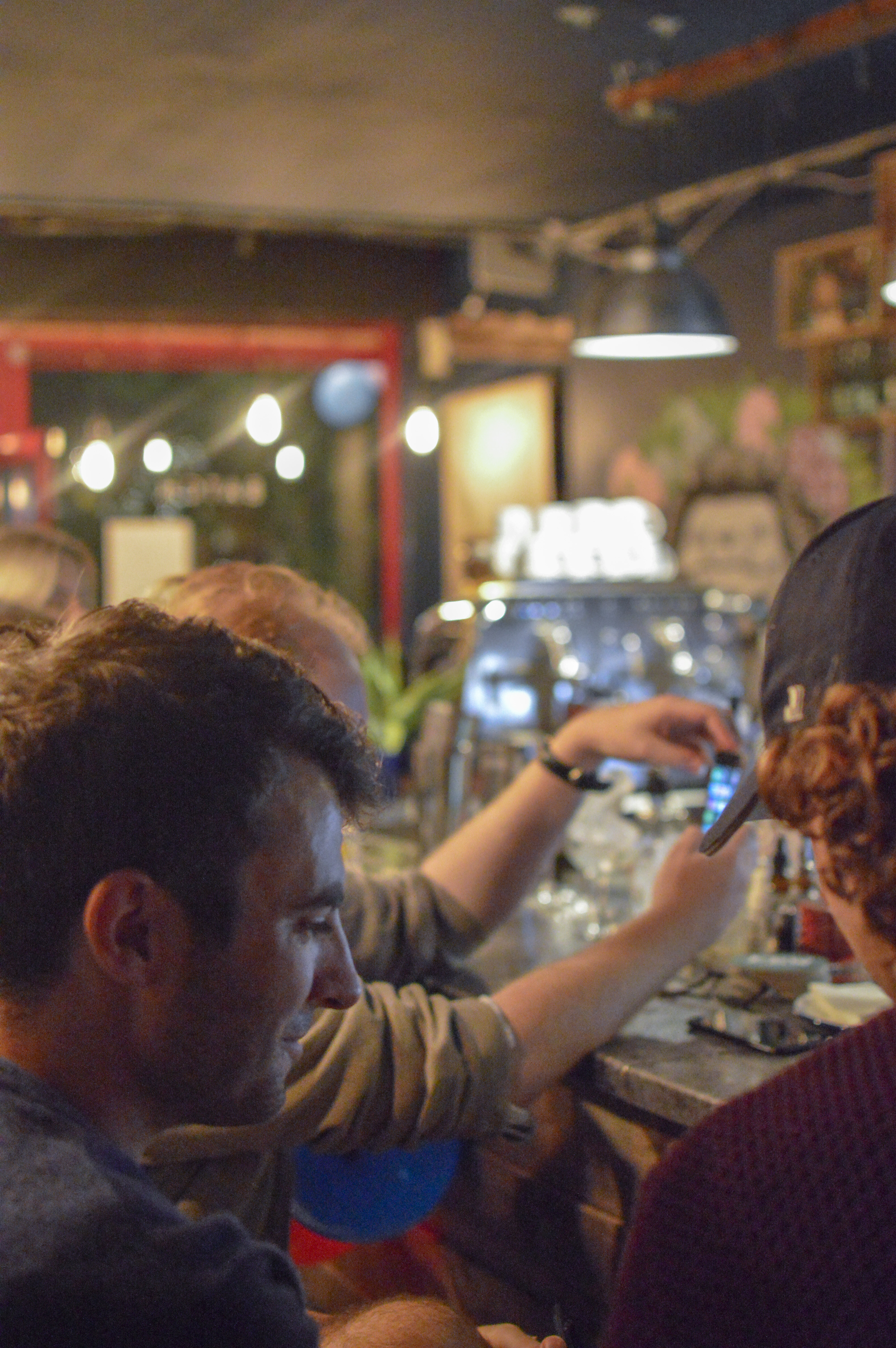 Vibrant networking event at BATCH Cocktail Bar with warm lighting and casual atmosphere.