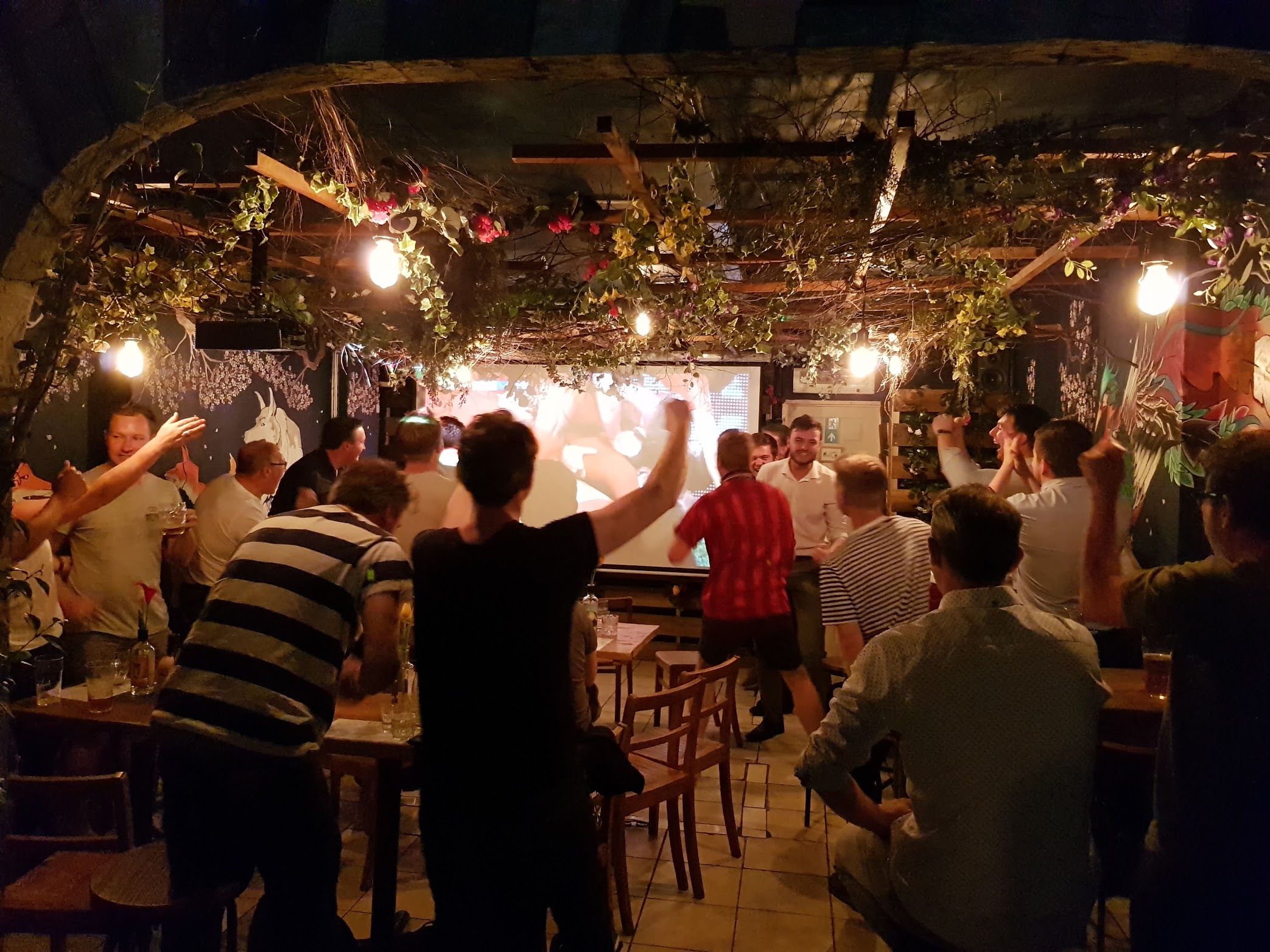 Lively BATCH Cocktail Bar event with engaged audience and warm lighting ambiance.