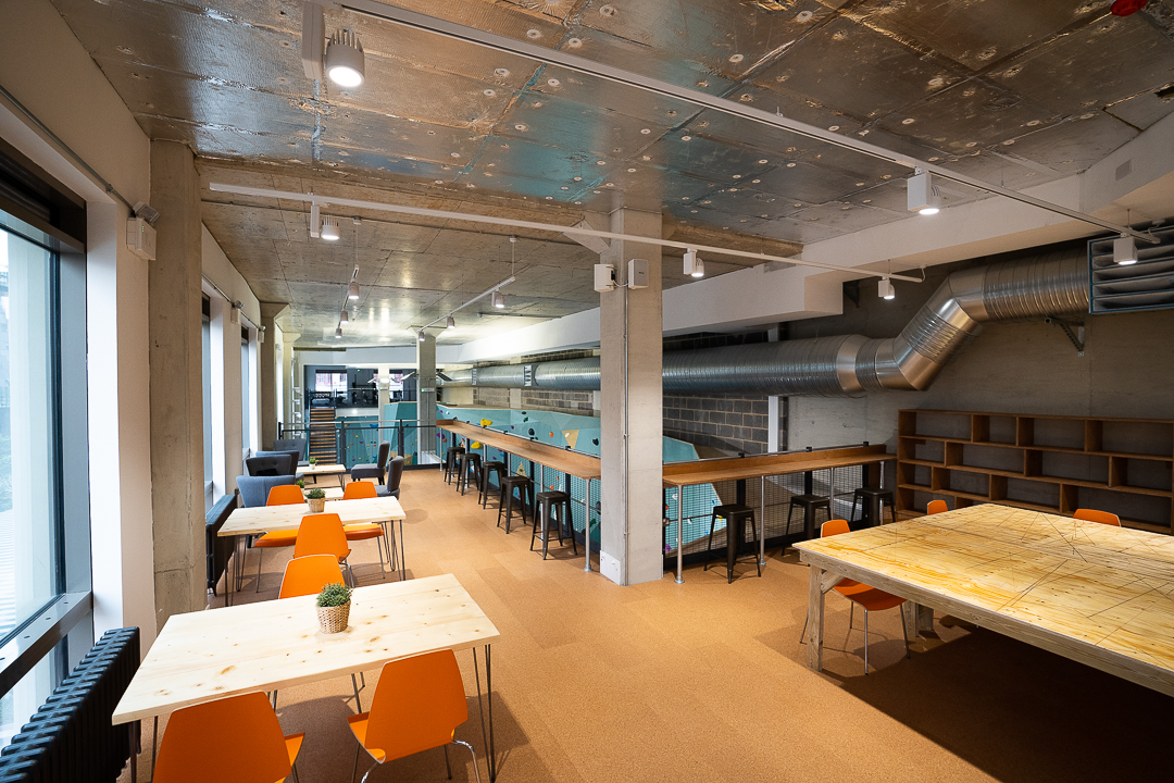 Versatile meeting space with flexible seating for workshops and brainstorming sessions.