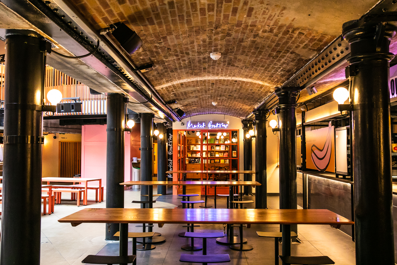 The Market Bookshop event space with exposed brick, ideal for networking and gatherings.