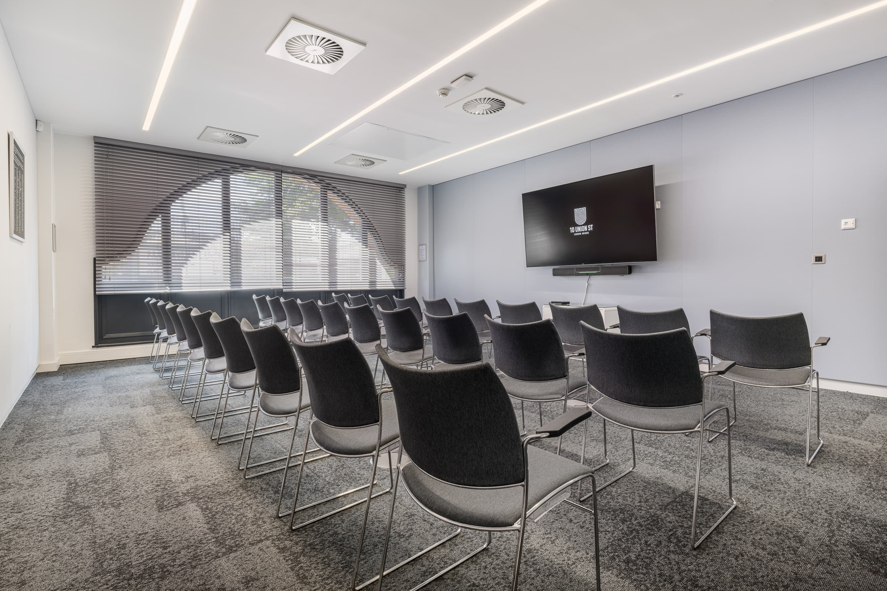 Modern theater-style meeting room at 10 Union Street for corporate presentations and workshops.
