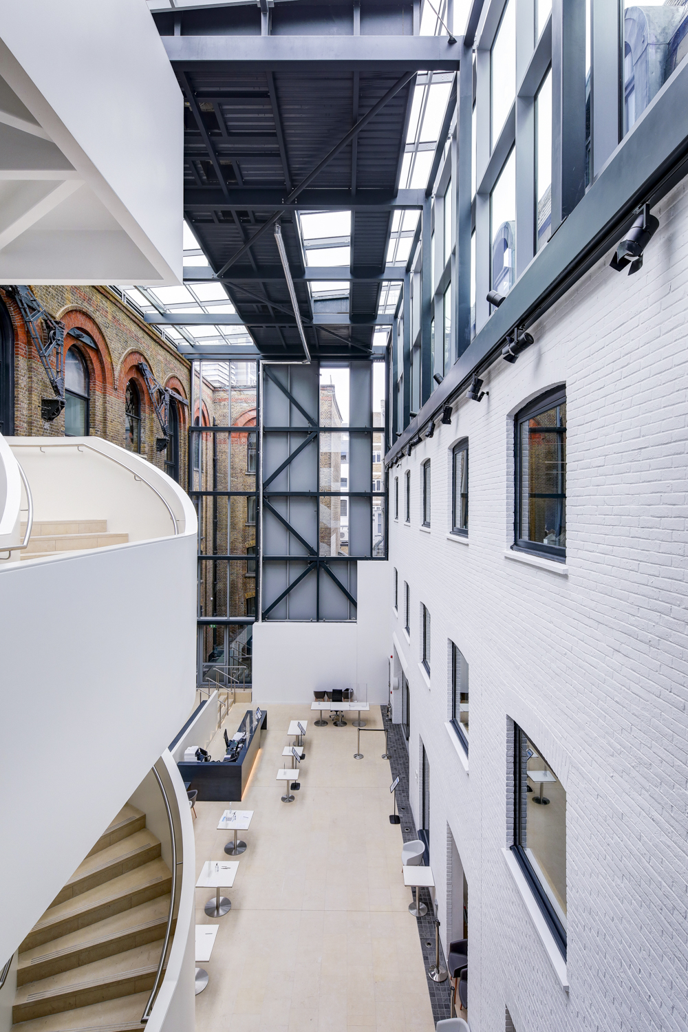 Modern event space with large windows, ideal for networking and workshops.