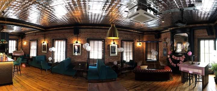 Charming event space with exposed brick walls for gatherings and celebrations.