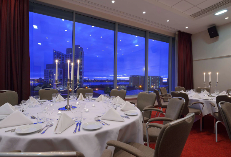 Elegant dining setup in Kings 3, Radisson Blu, Liverpool for corporate events and formal dinners.