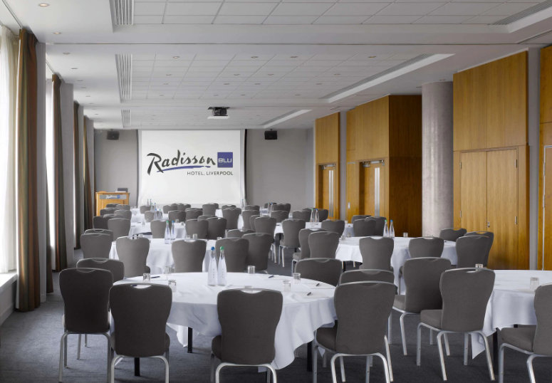 Meeting space at Radisson Blu, Liverpool with round tables for professional events