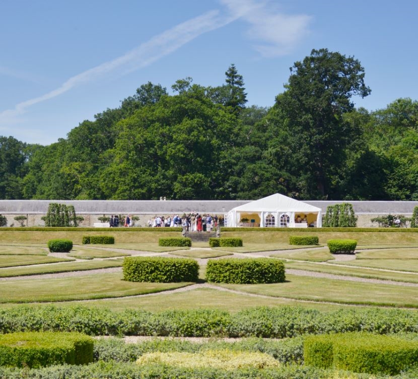 Elegant outdoor event tent in manicured garden at Radisson Blu, Liverpool for weddings.