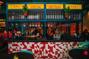 Vibrant bar area at Las Iguanas Bath, perfect for networking events and cocktail receptions.