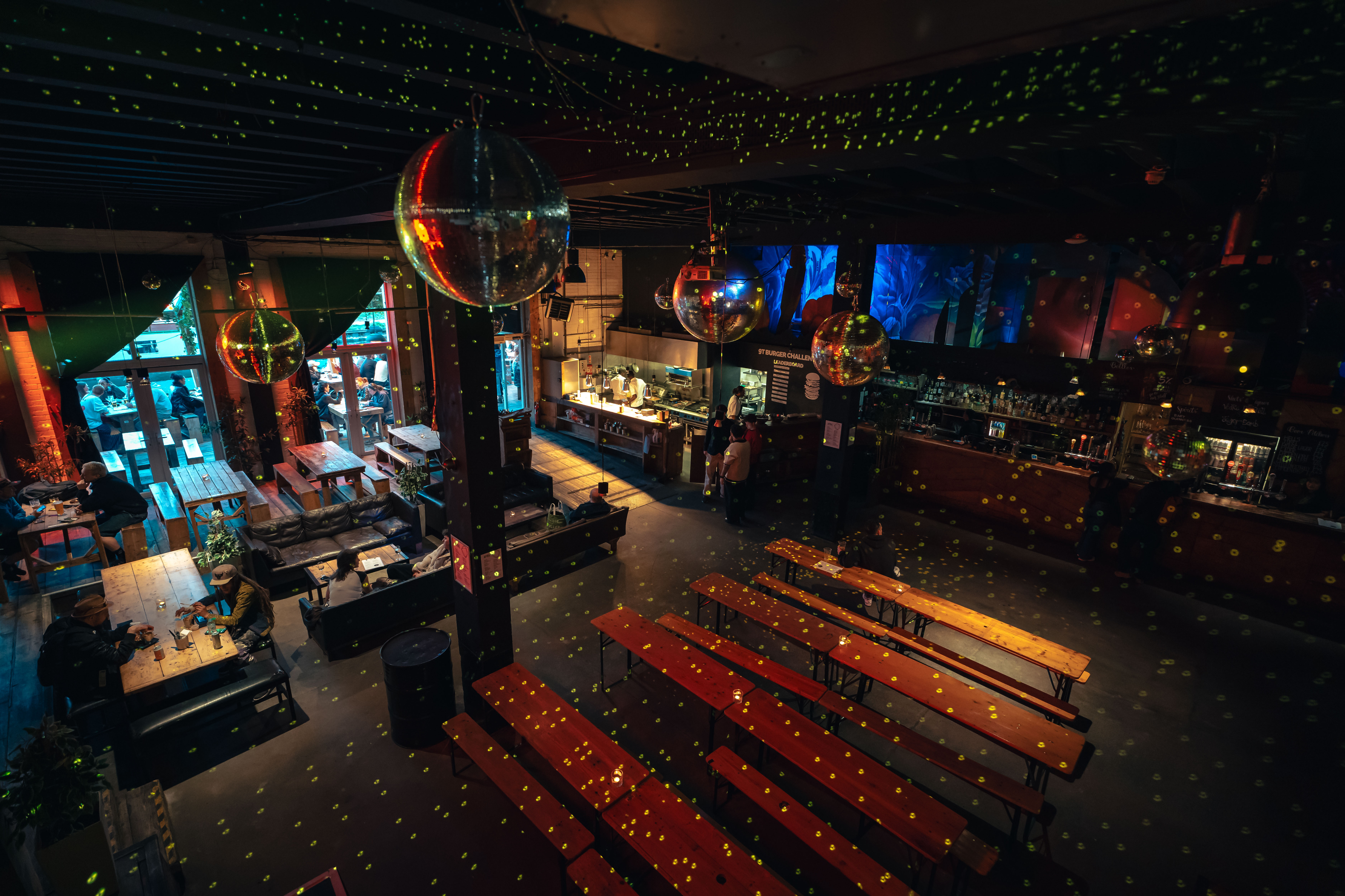 Vibrant event space at 90 Bar & Kitchen with high ceilings for gatherings and celebrations.