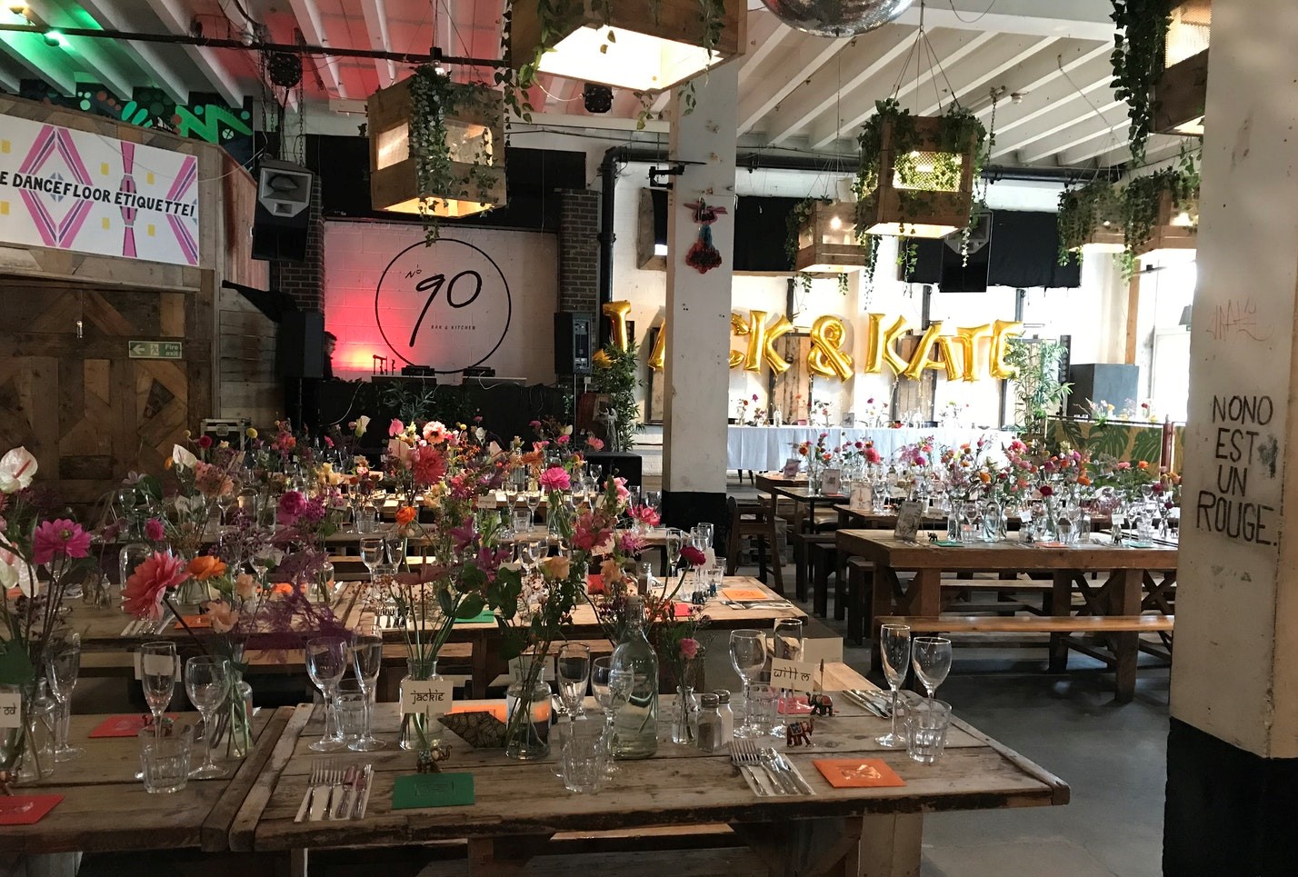 Vibrant event space at 90 Bar & Kitchen with floral centerpieces for weddings and celebrations.