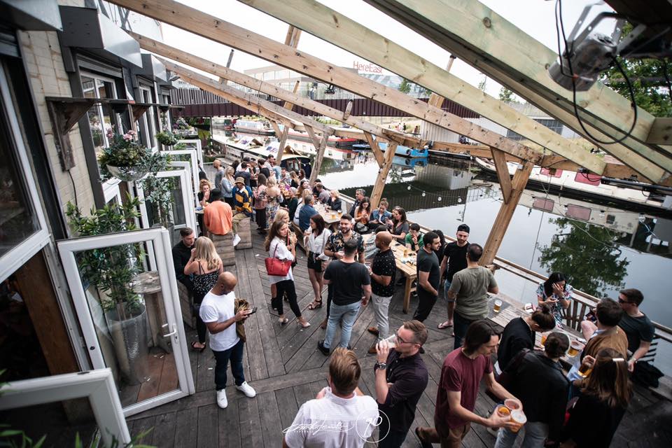 Outdoor event at 90 Bar & Kitchen, featuring a lively waterfront gathering space.