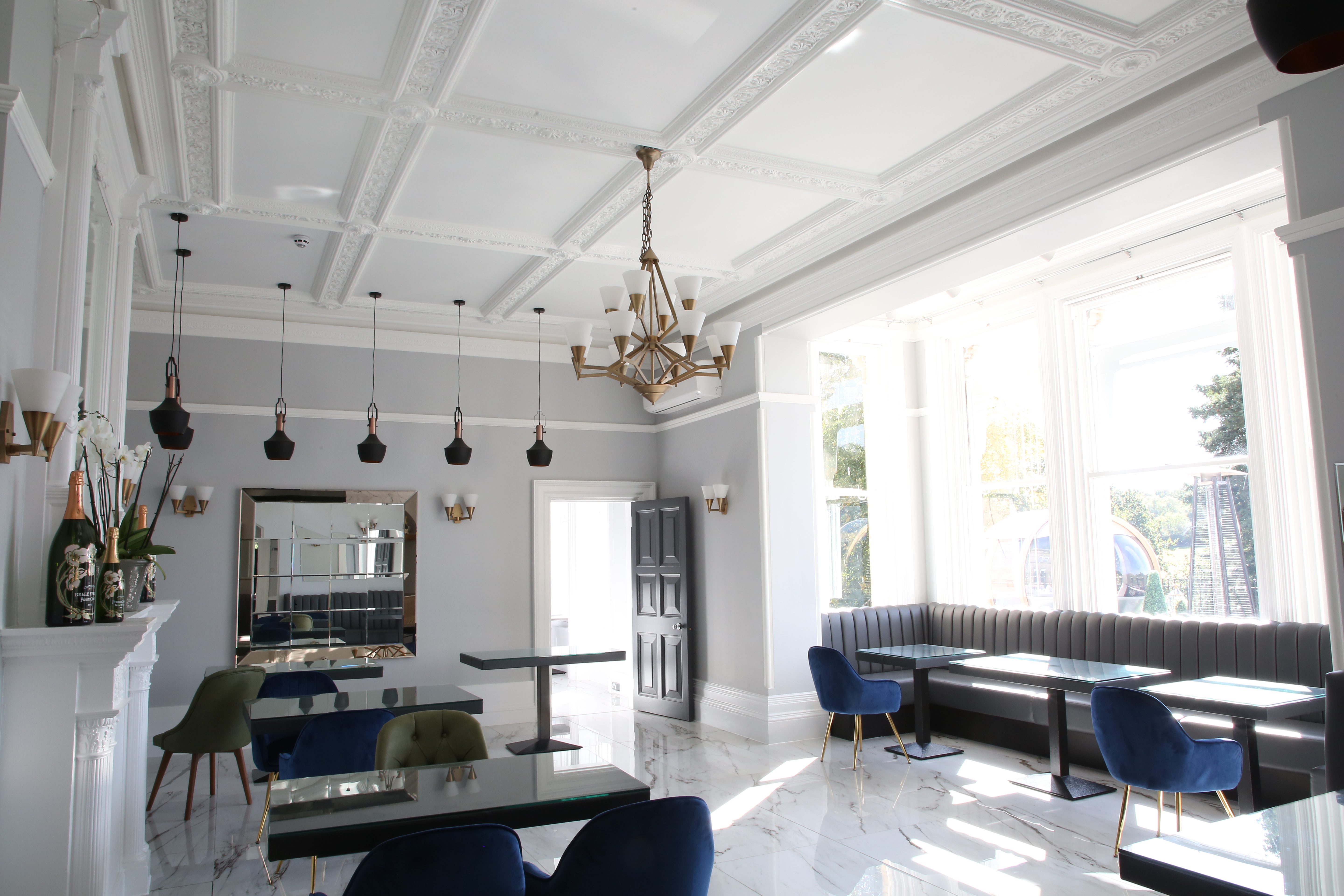 Hilltop Lounge at Ponsbourne Park Hotel, elegant event space with chandelier, corporate gatherings.