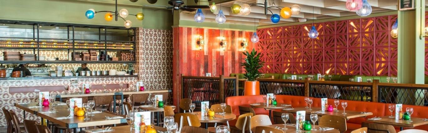 Vibrant Las Iguanas Cheshire venue with colorful decor for casual meetings and events.