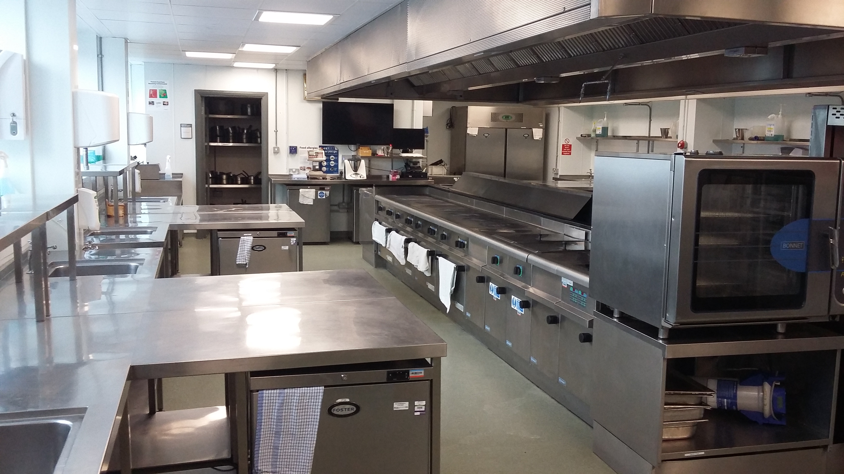 Modern commercial kitchen at Pillars Restaurant, ideal for catering events and conferences.