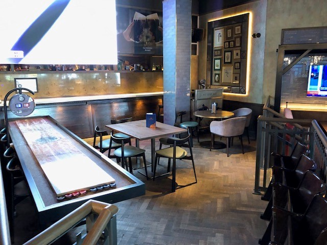 Versatile event space in Westwood with sleek bar for networking and social gatherings.