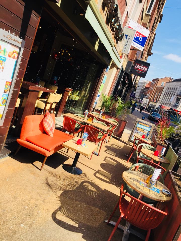 Vibrant outdoor seating at Las Iguanas Leicester, ideal for casual meetings and networking.
