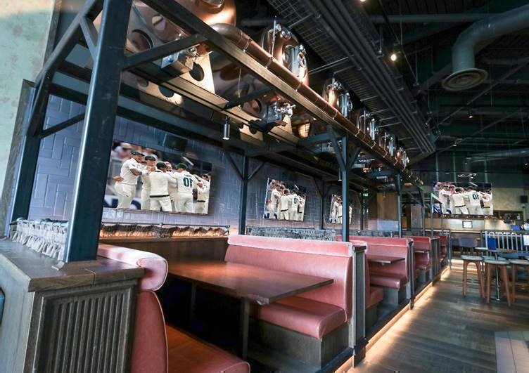 Modern dining space with booth seating for networking events in Westwood.