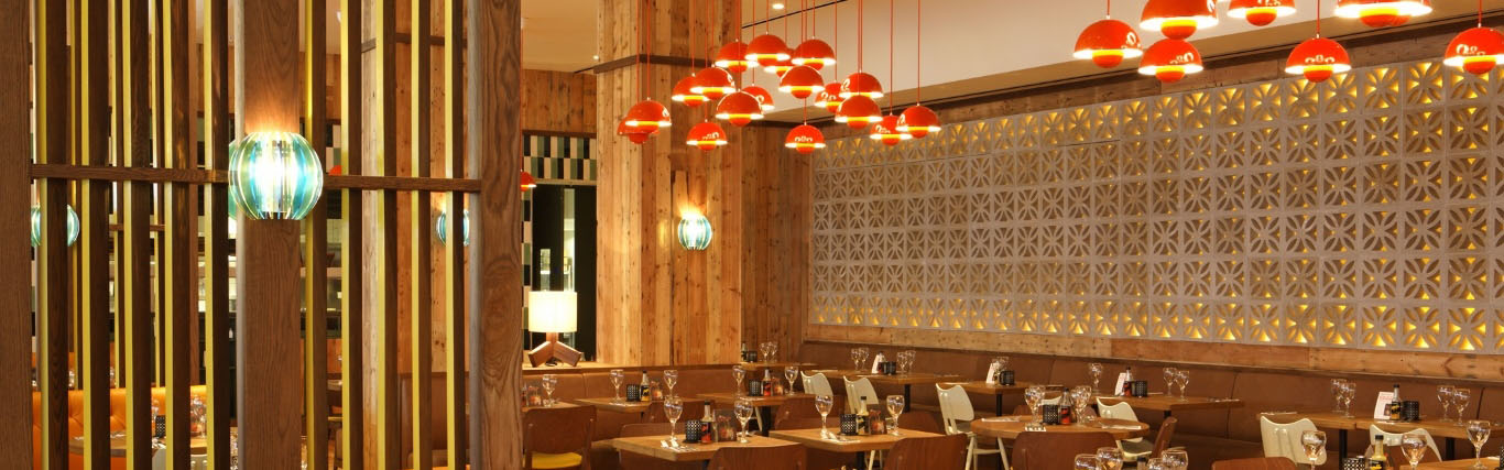 Stylish Las Iguanas venue in Stratford with warm wood accents, perfect for events.