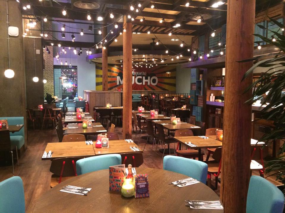 Vibrant Las Iguanas venue with warm lighting, perfect for events and gatherings.