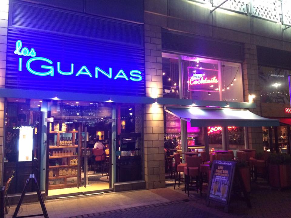 Vibrant Las Iguanas Reading venue with neon signage for casual networking events.
