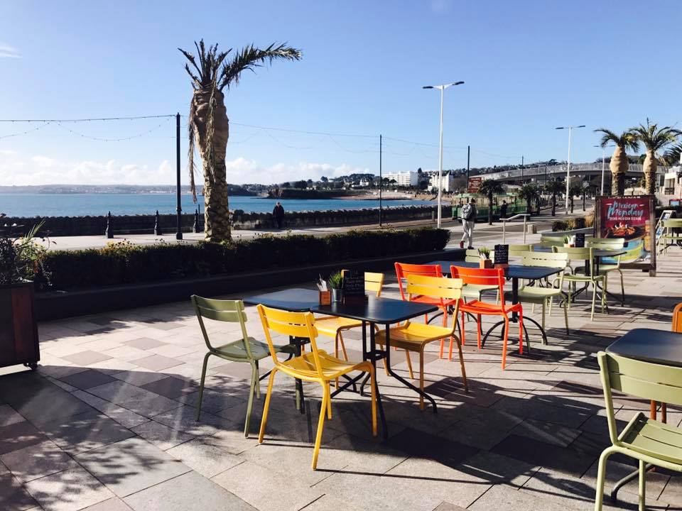 Vibrant outdoor seating at Las Iguanas Torquay, ideal for networking events and gatherings.