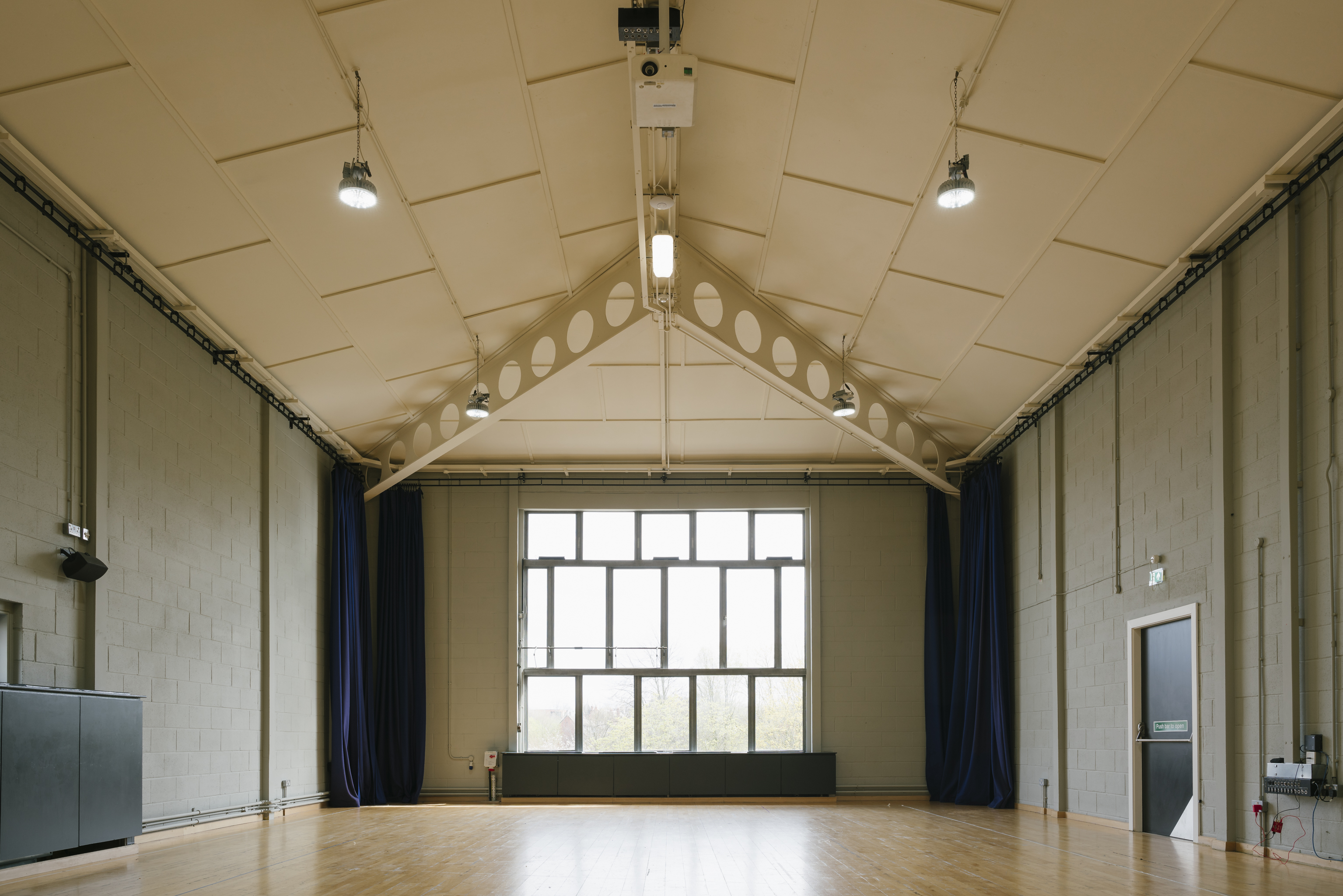 Spacious, well-lit event space with high ceilings at Contact Theatre for meetings and workshops.