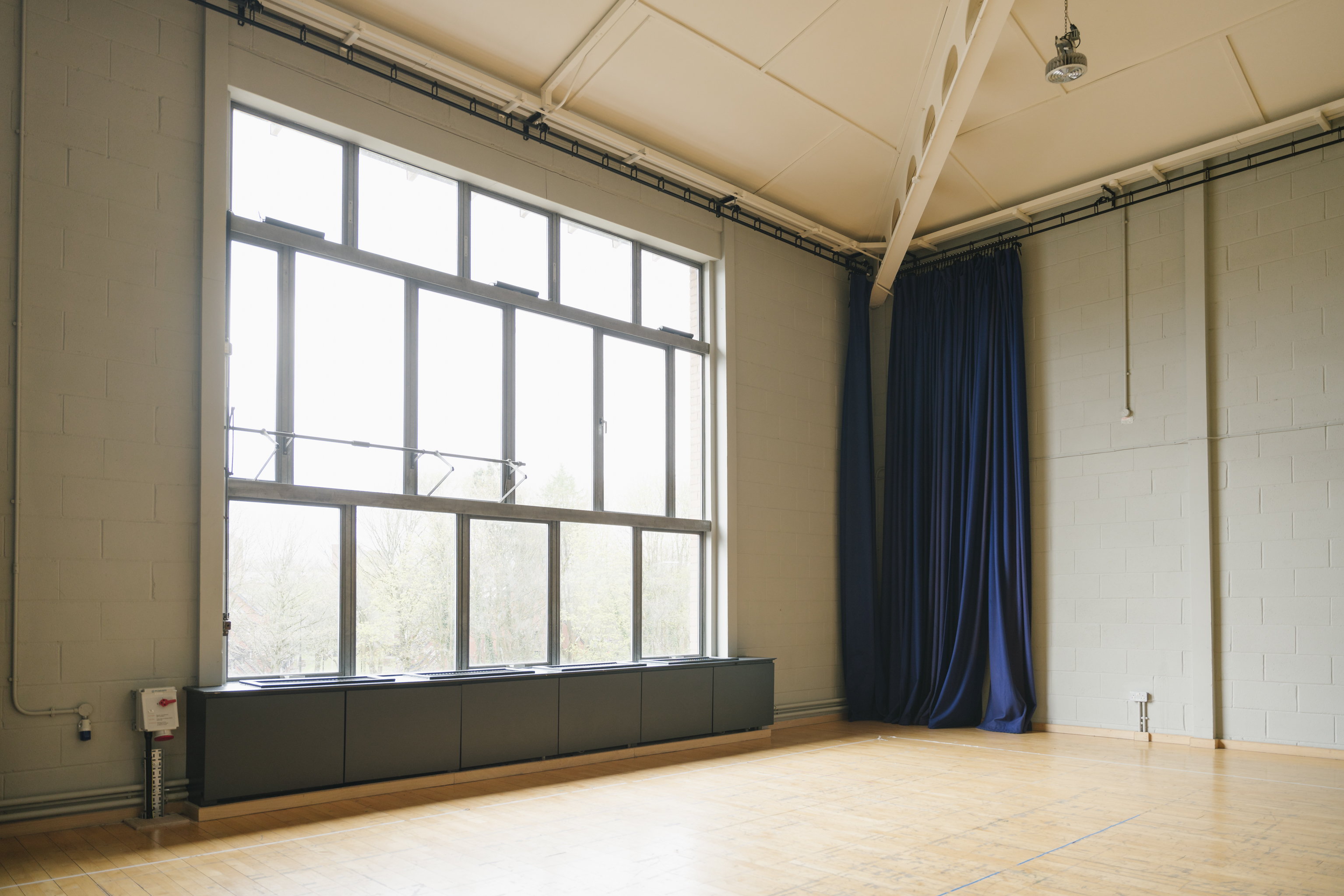 Spacious event space with large windows, ideal for meetings and workshops at Contact Theatre.