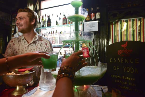 Vibrant bar setup with multi-tiered drink fountain for themed events at Hotel Pelirocco.