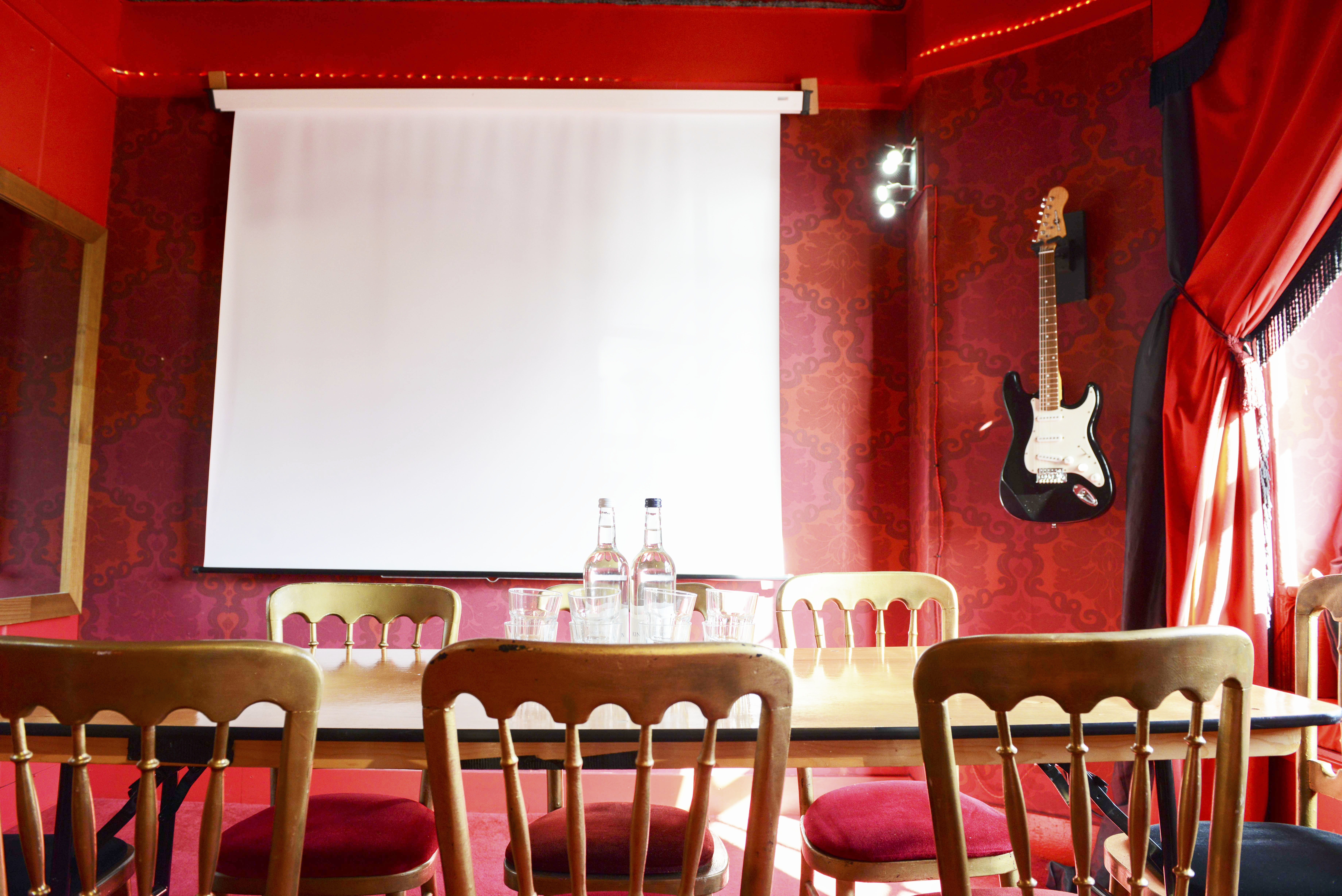 Vibrant meeting space at Hotel Pelirocco with stylish decor for team-building events.