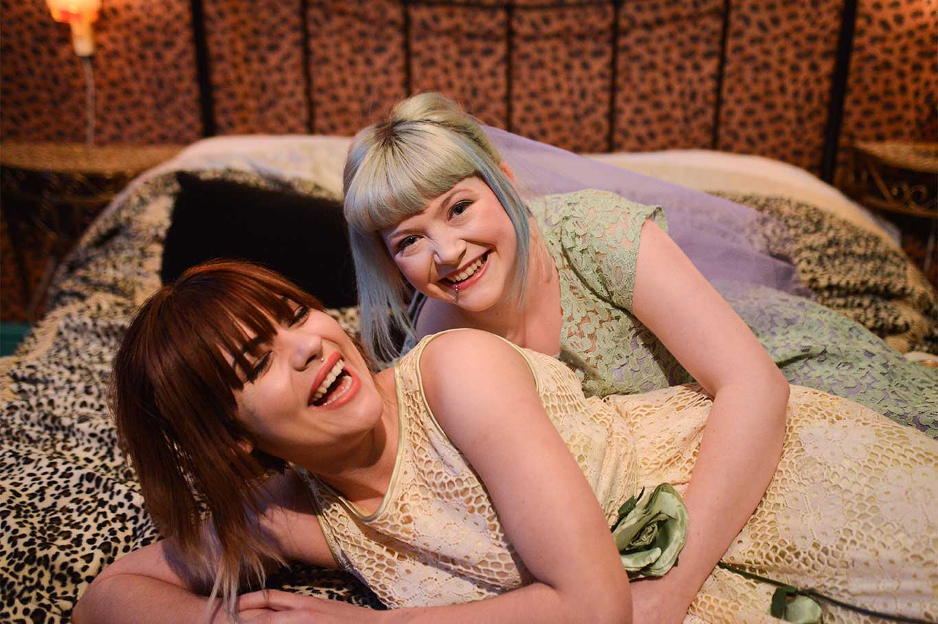 Two women enjoying a vibrant film location at Hotel Pelirocco for themed events.