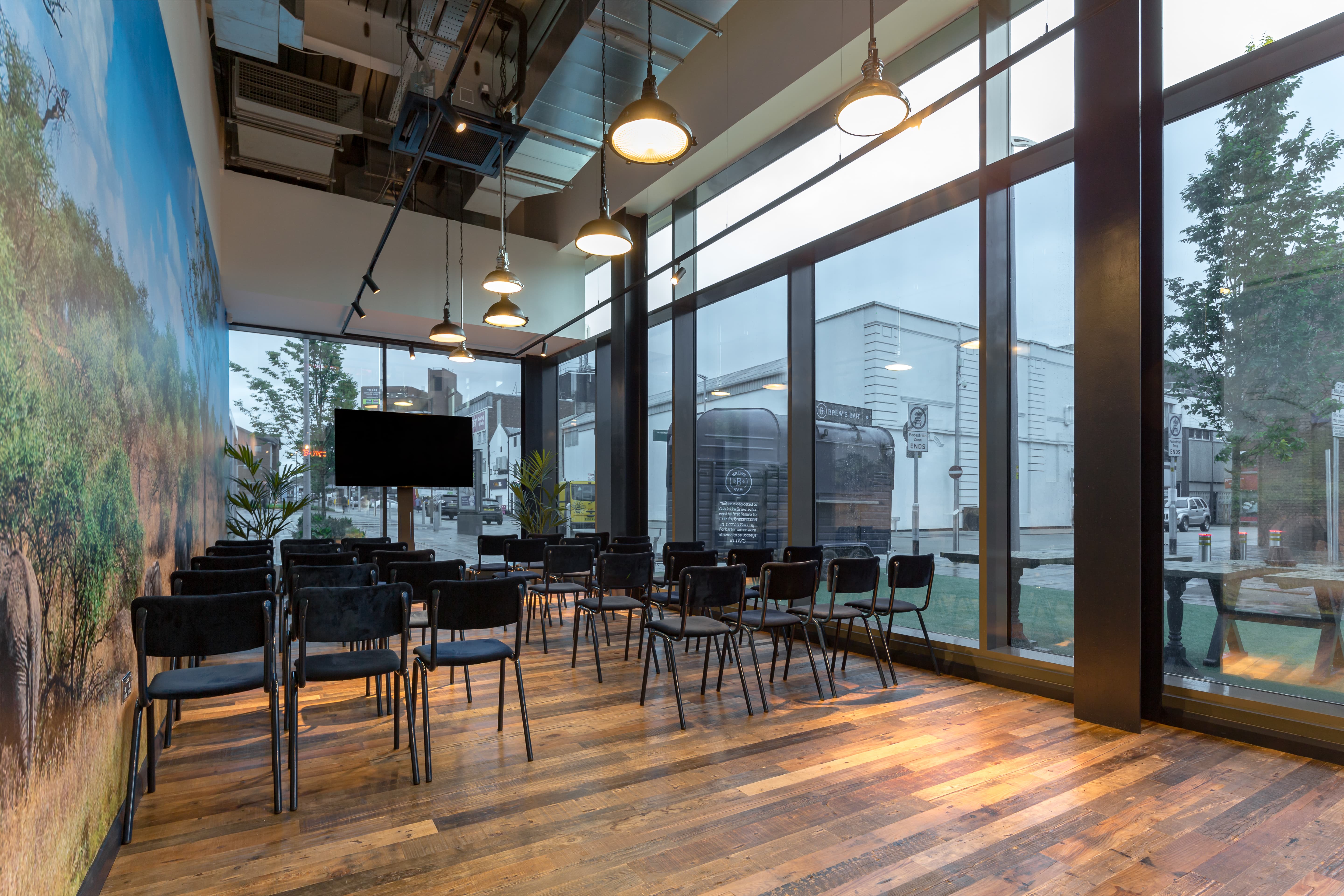 Modern meeting space with large windows for presentations at The Light Cinema Stockport.