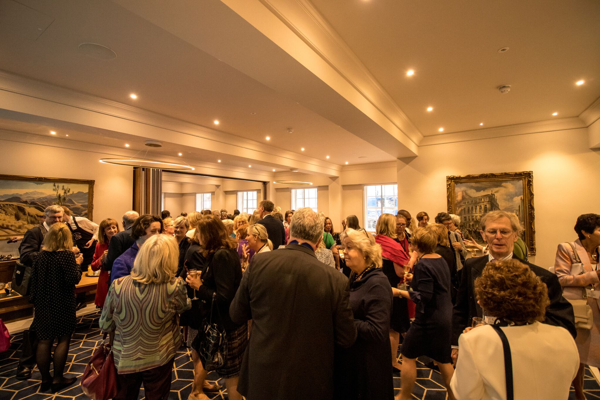 Vibrant networking event in the elegant Ground Floor Foyer at 87 Barts Close.