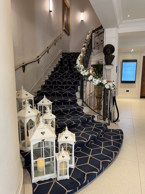 Elegant staircase in 87 Barts Close foyer, perfect for upscale events and weddings.