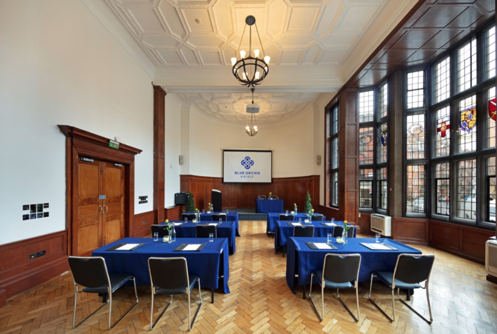 Wellington Suite meeting room with blue tablecloths for corporate events and gatherings.