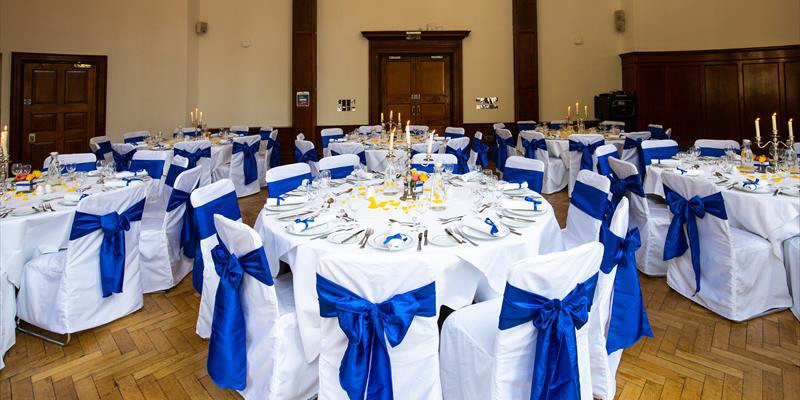 Elegant banquet hall with round tables, ideal for formal events and celebrations.