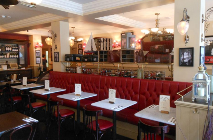 Elegant Café Rouge venue with red leather banquette for intimate gatherings and corporate events.