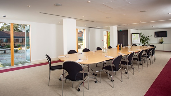 Modern meeting room with oval table at Lifehouse Spa, perfect for workshops and executive meetings.