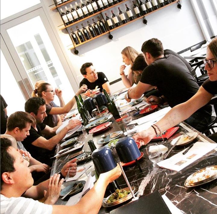 Group meeting at The Den, Covent Garden, fostering teamwork and creativity over a meal.