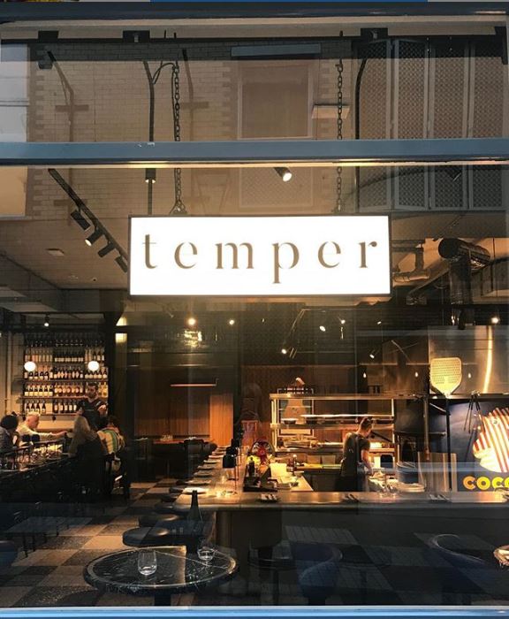Modern restaurant "temper" in Covent Garden with open kitchen, ideal for networking events.