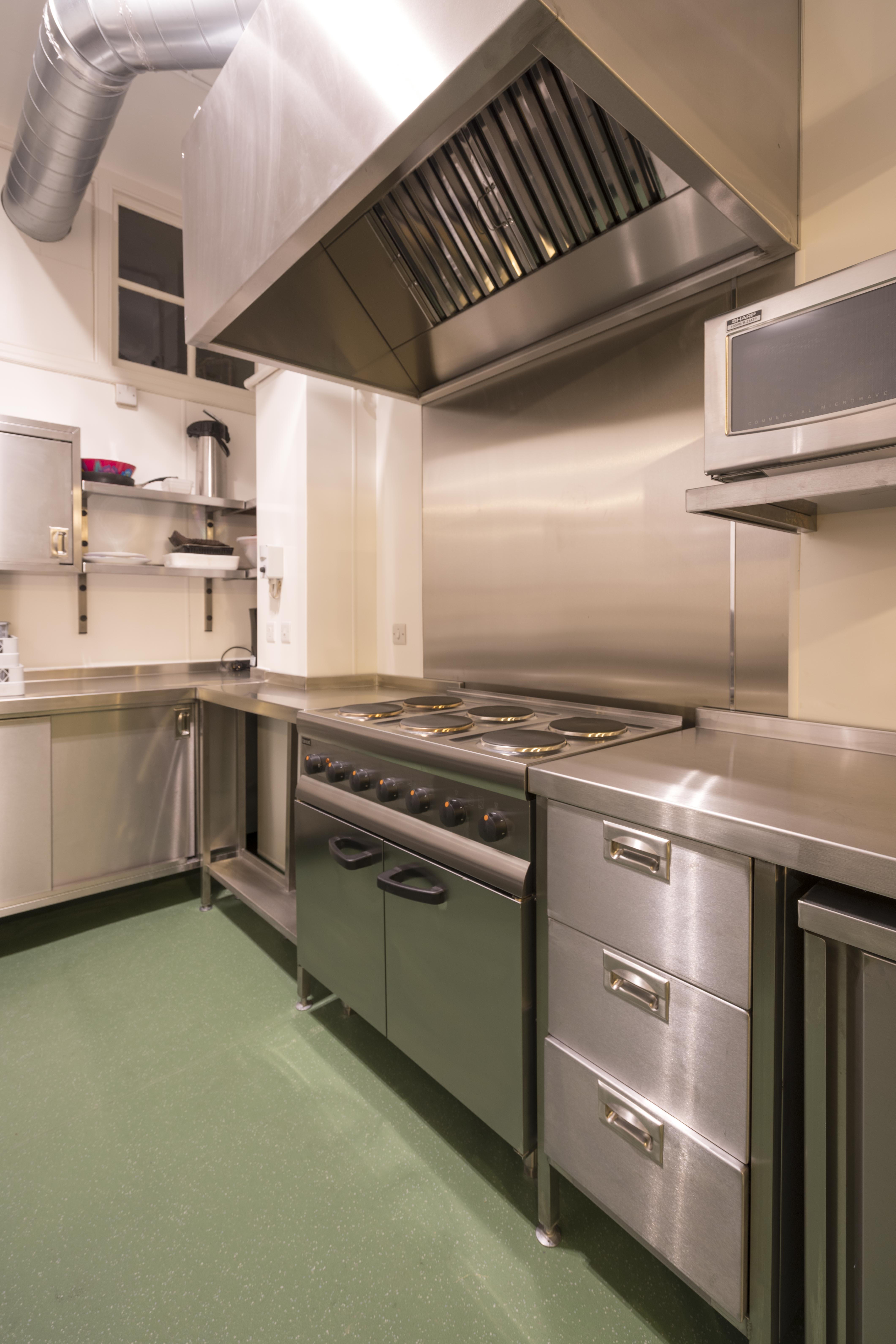 Modern commercial kitchen with stainless steel surfaces for efficient event catering.