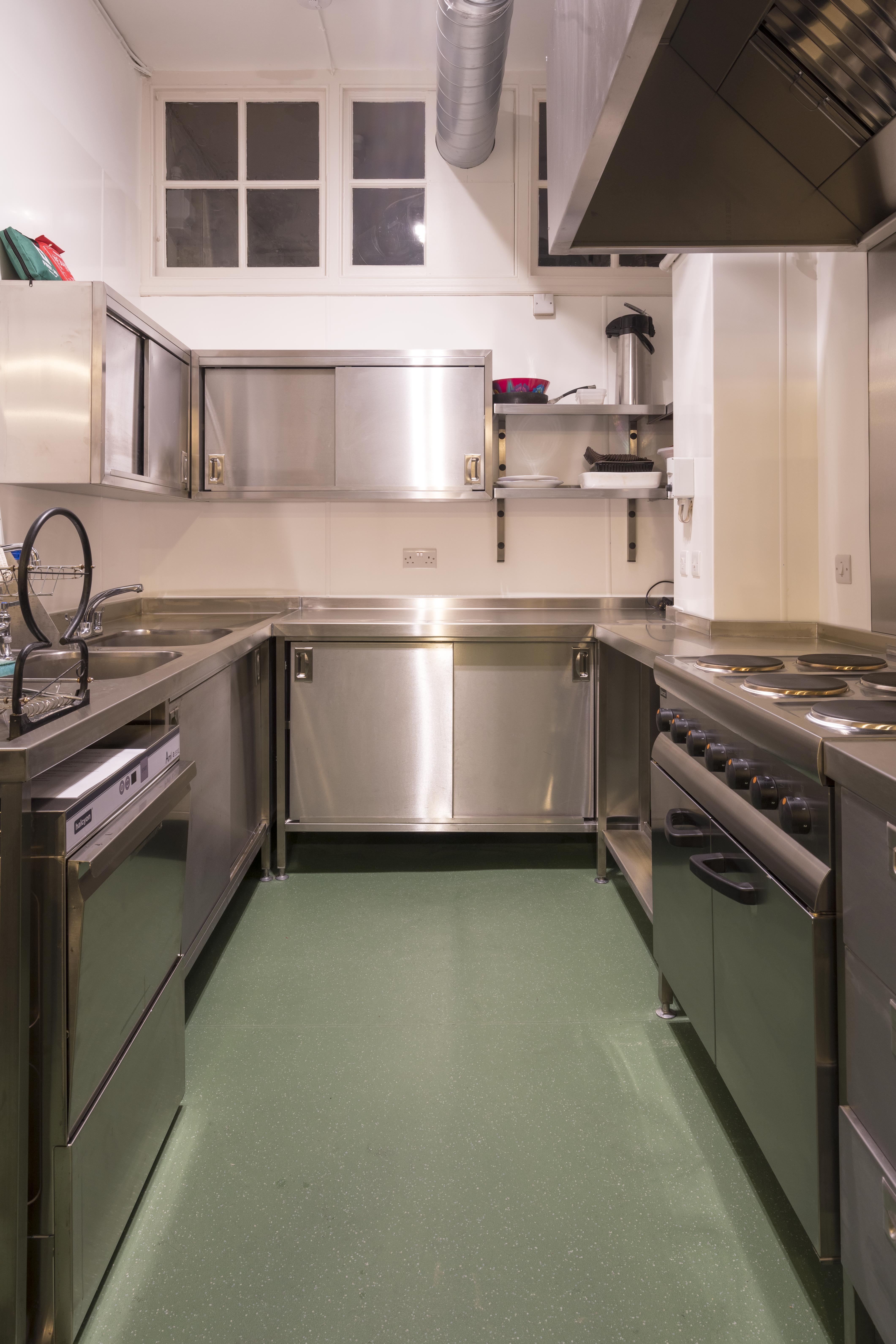 Commercial kitchen in Unity Islington with stainless steel surfaces for catering events.