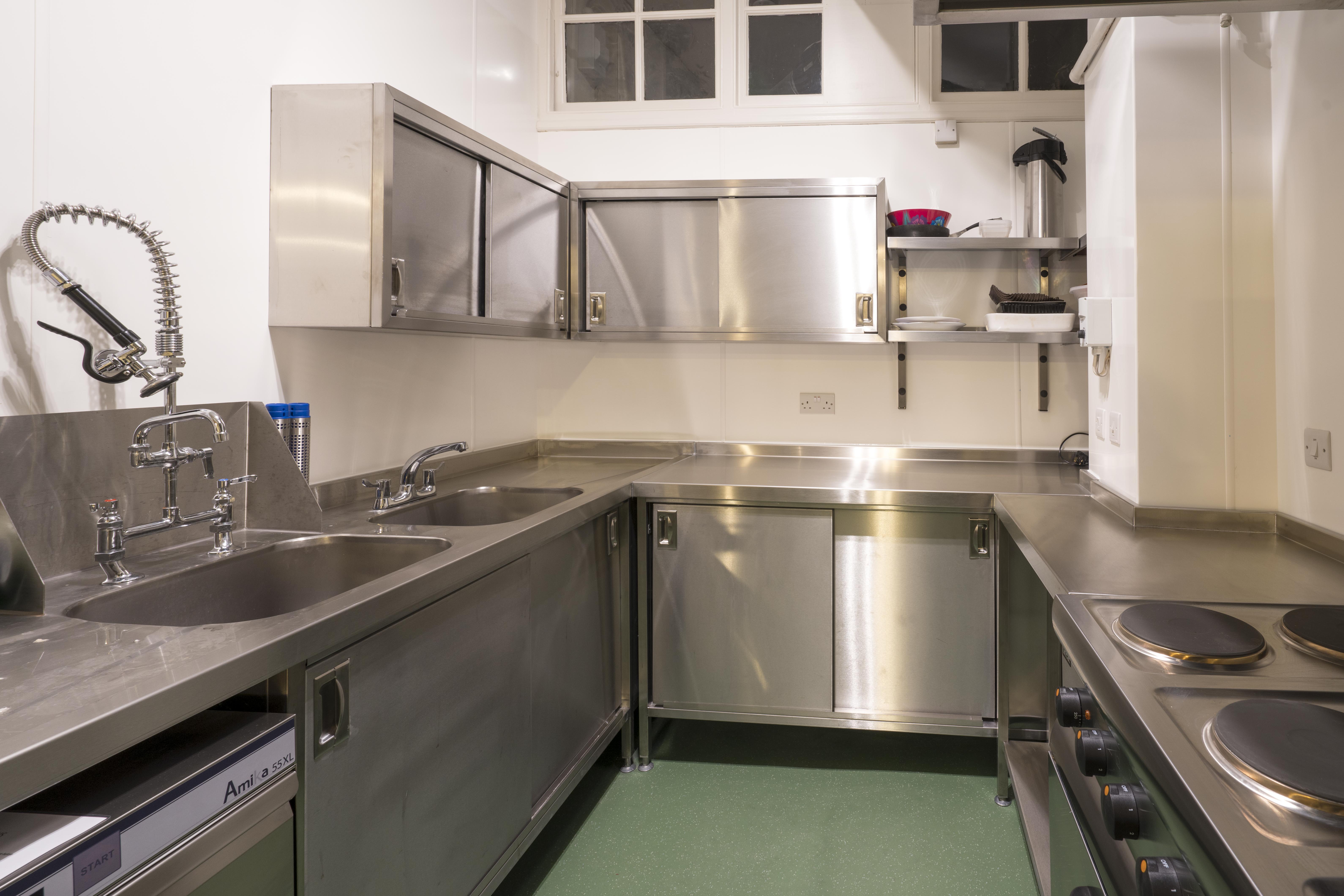 Clean commercial kitchen in Unity Islington, featuring stainless steel surfaces for catering events.