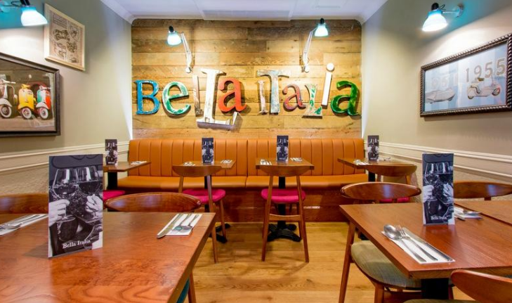 Cozy dining area at Bella Italia London, ideal for intimate gatherings and meetings.