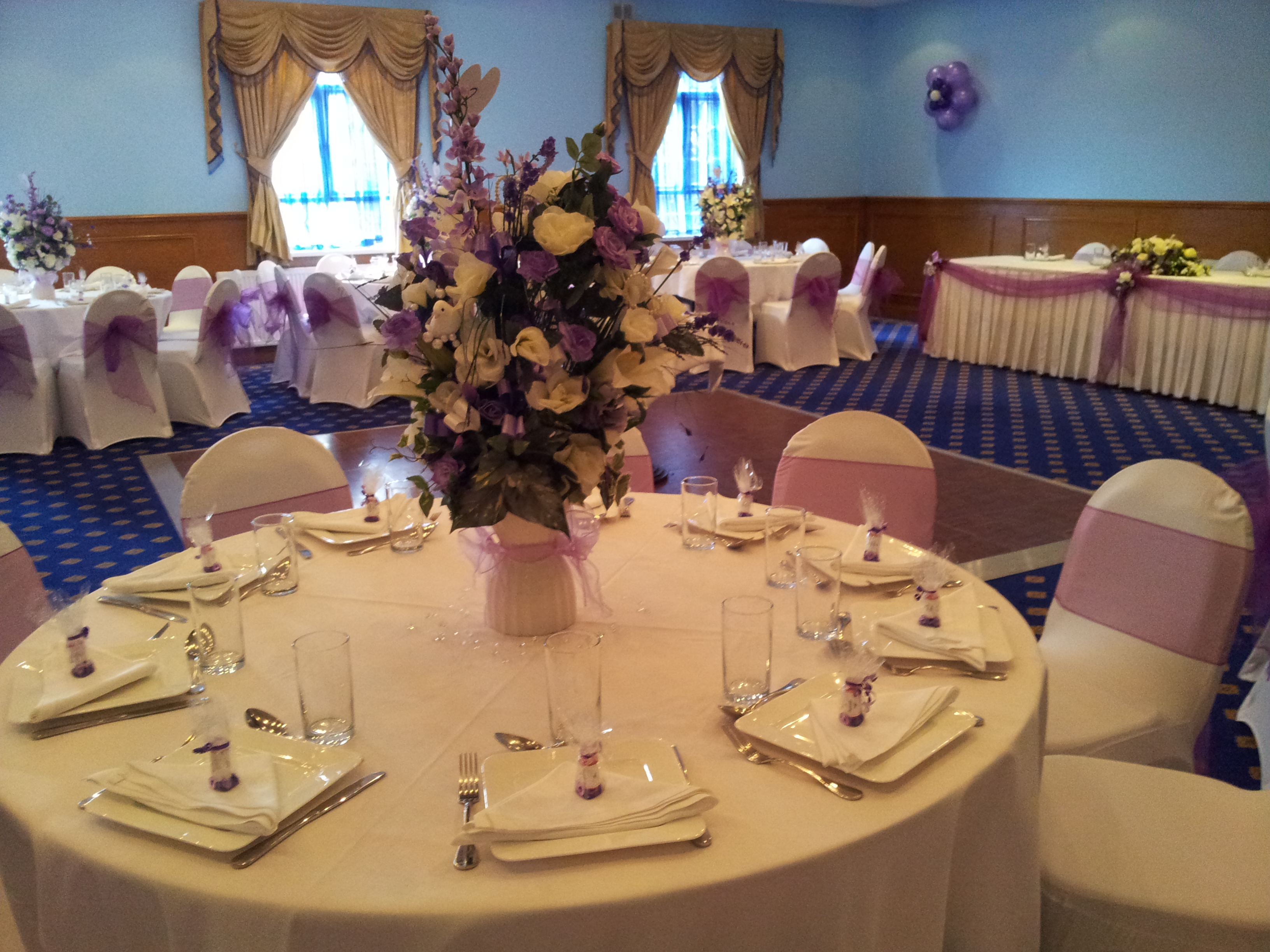 Elegant Banqueting Hall with lavender accents, ideal for weddings and formal events.