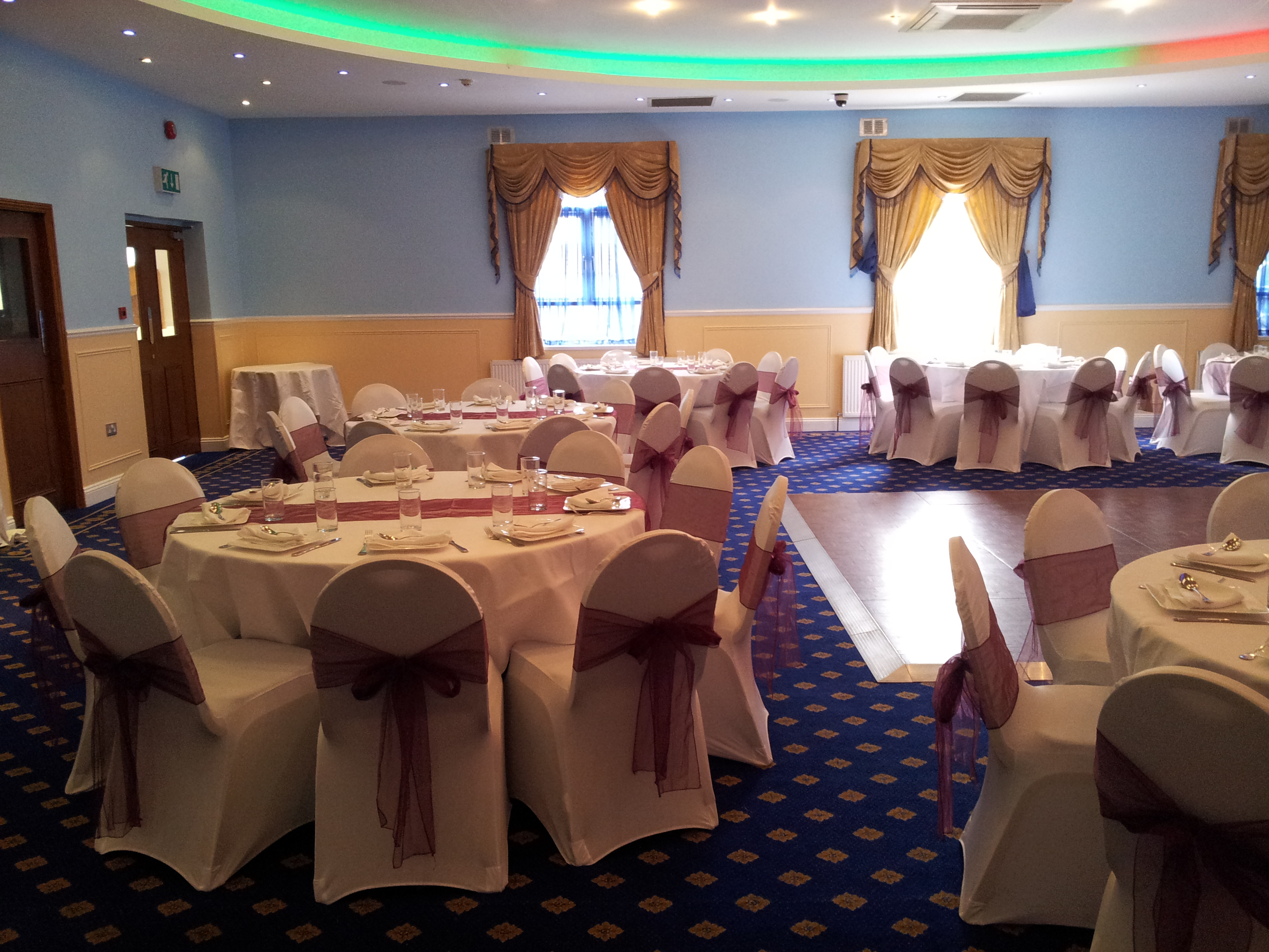 Ealing Banqueting Suite with elegant round tables for weddings and corporate events.