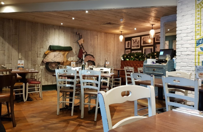 Cozy rustic dining space at Bella Italia Edinburgh for intimate gatherings and meetings.