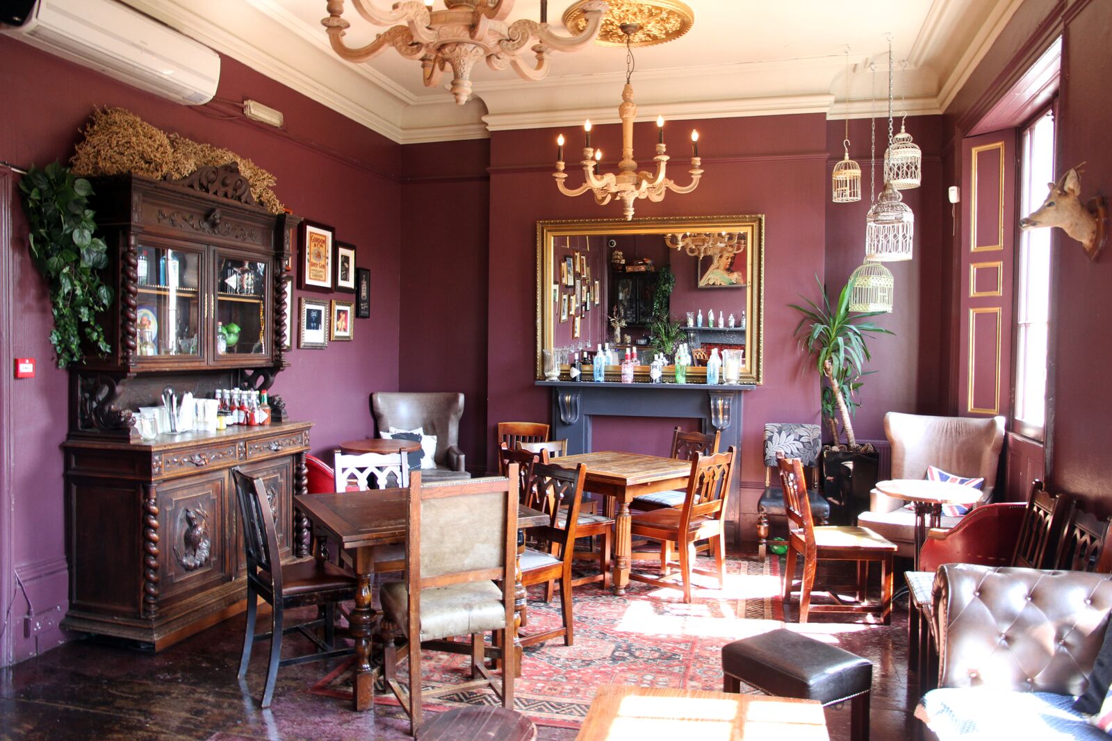 Intimate Gin Lounge event space with vintage decor, ideal for gatherings and meetings.