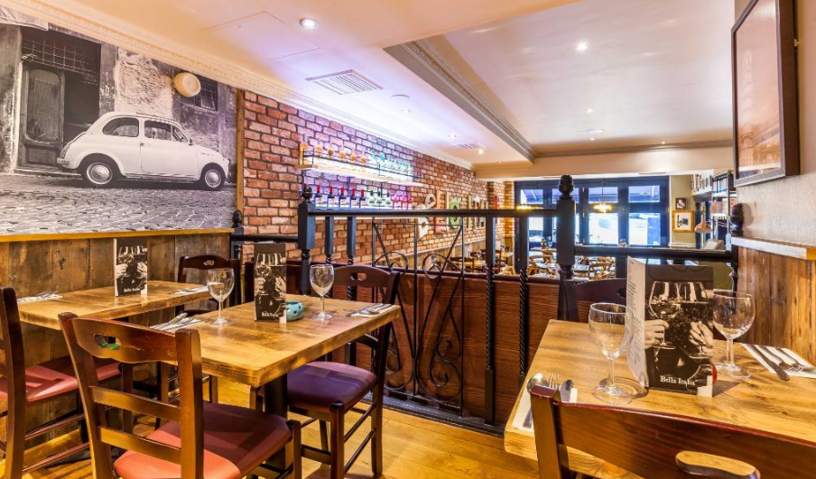 Cozy Bella Italia venue with warm wood tones, ideal for intimate dining events.