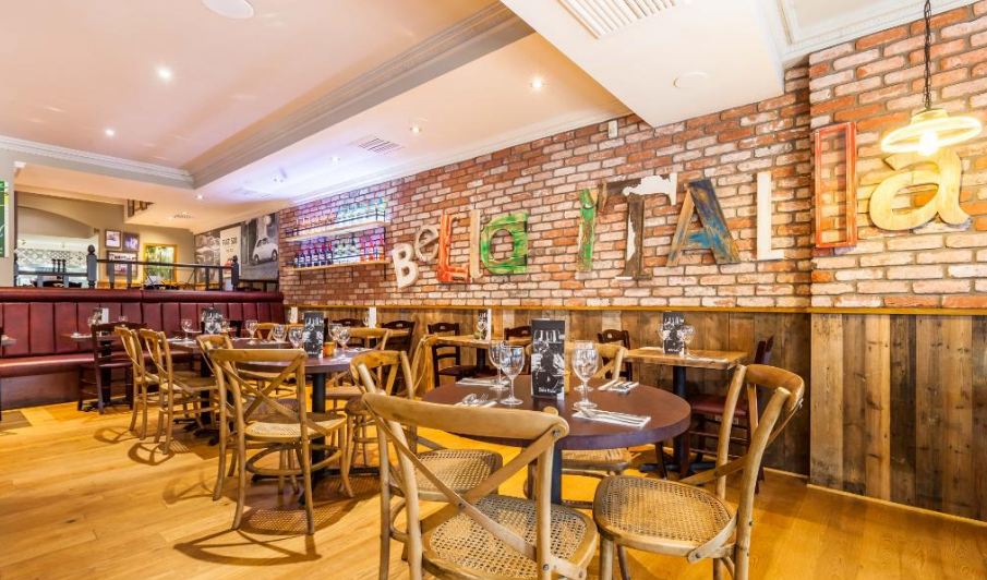 Charming Bella Italia venue with warm wood tones, ideal for intimate gatherings and corporate events.