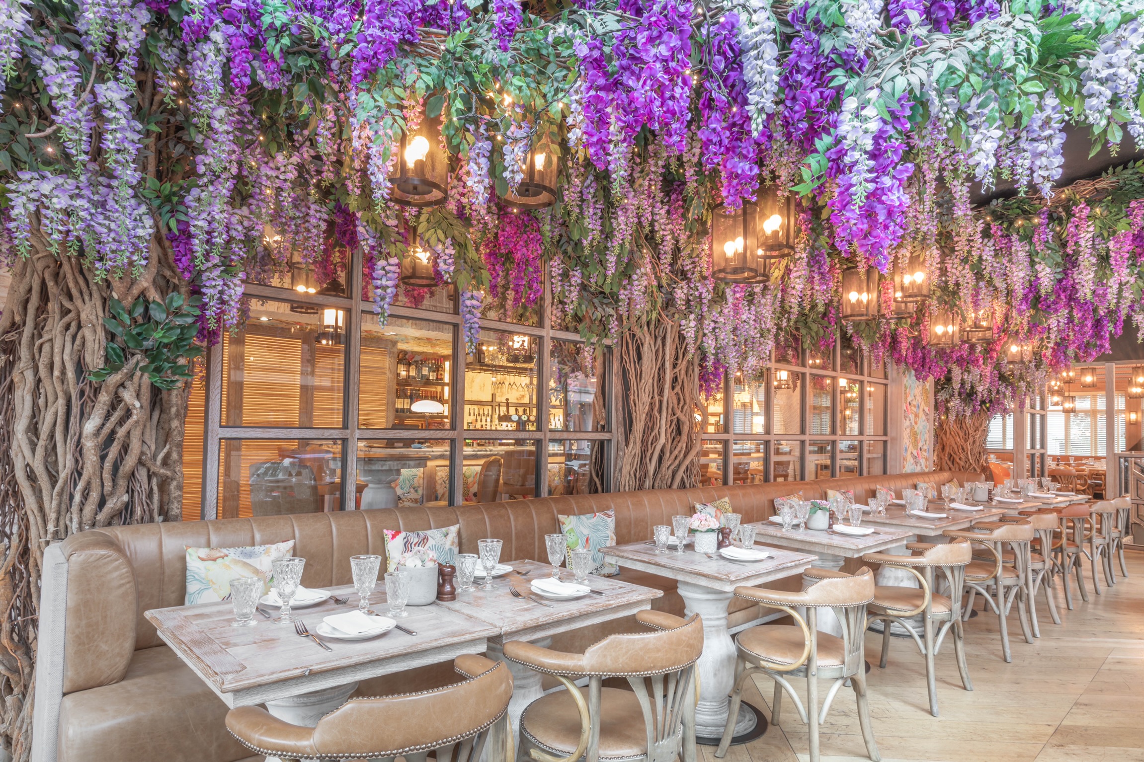 Elegant Blossom Room with purple floral decor, perfect for weddings and corporate events.